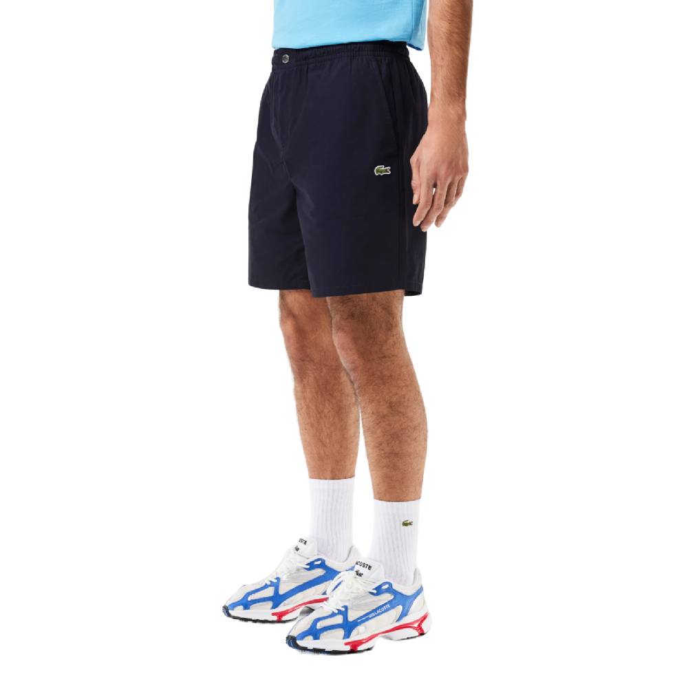 LACOSTE PANTALONI CORTI RELAXED FIT ELASTICIZZATI IN POPELINE DI COTONE GH7220HDE SKU: GH7220HDE Qualità